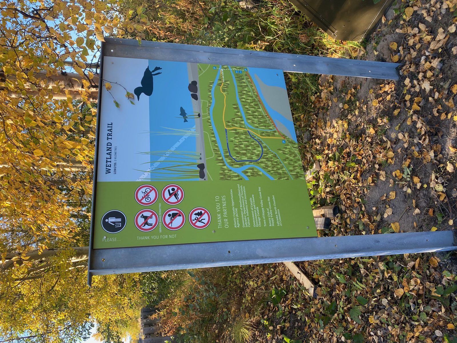 Wetland Trail sign marking an outdoor recreation area near North West River